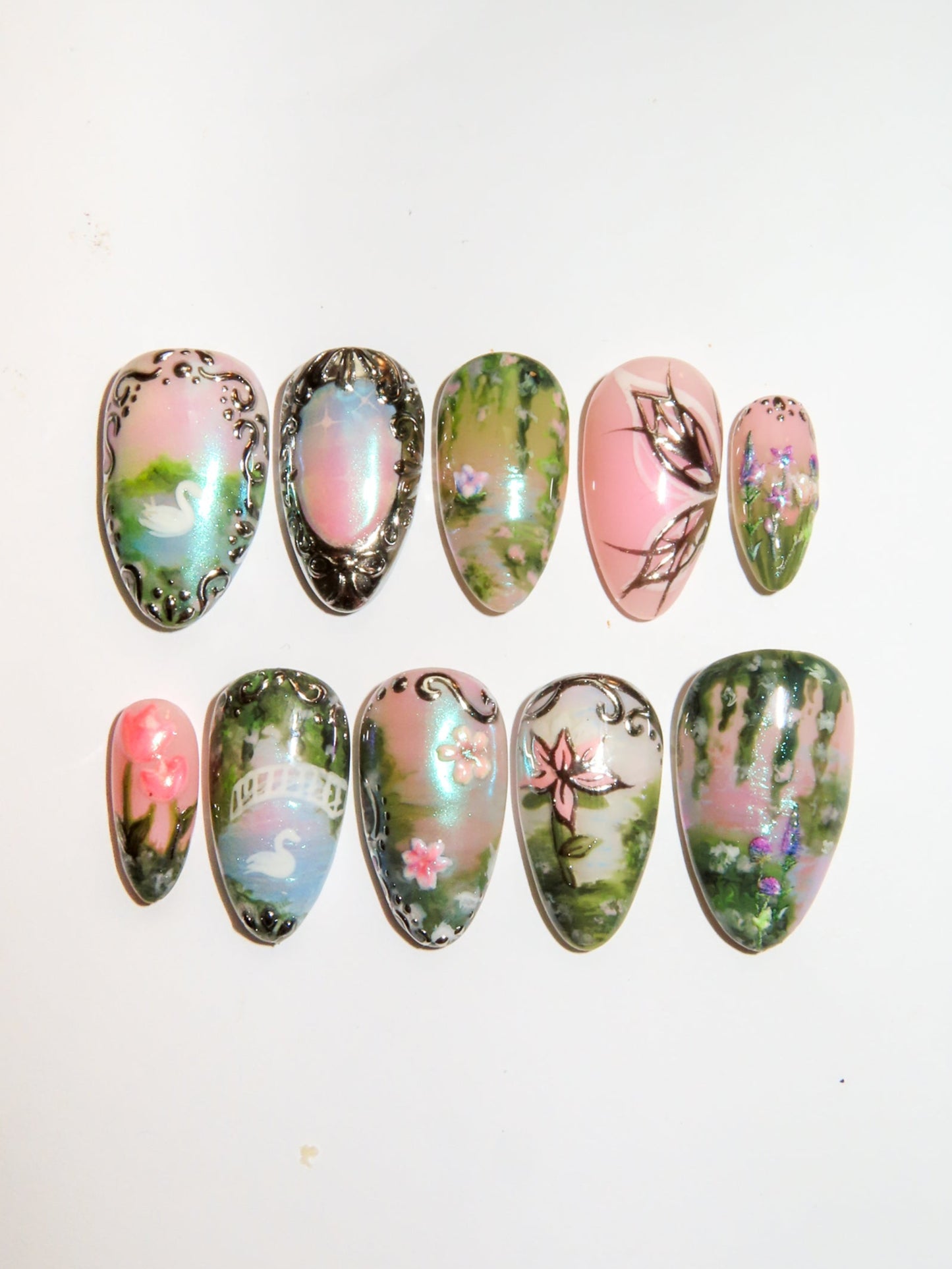 Set of decorative garden fairy nail art on a white background